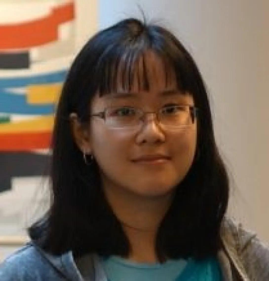 an woman with dark hair and glasses