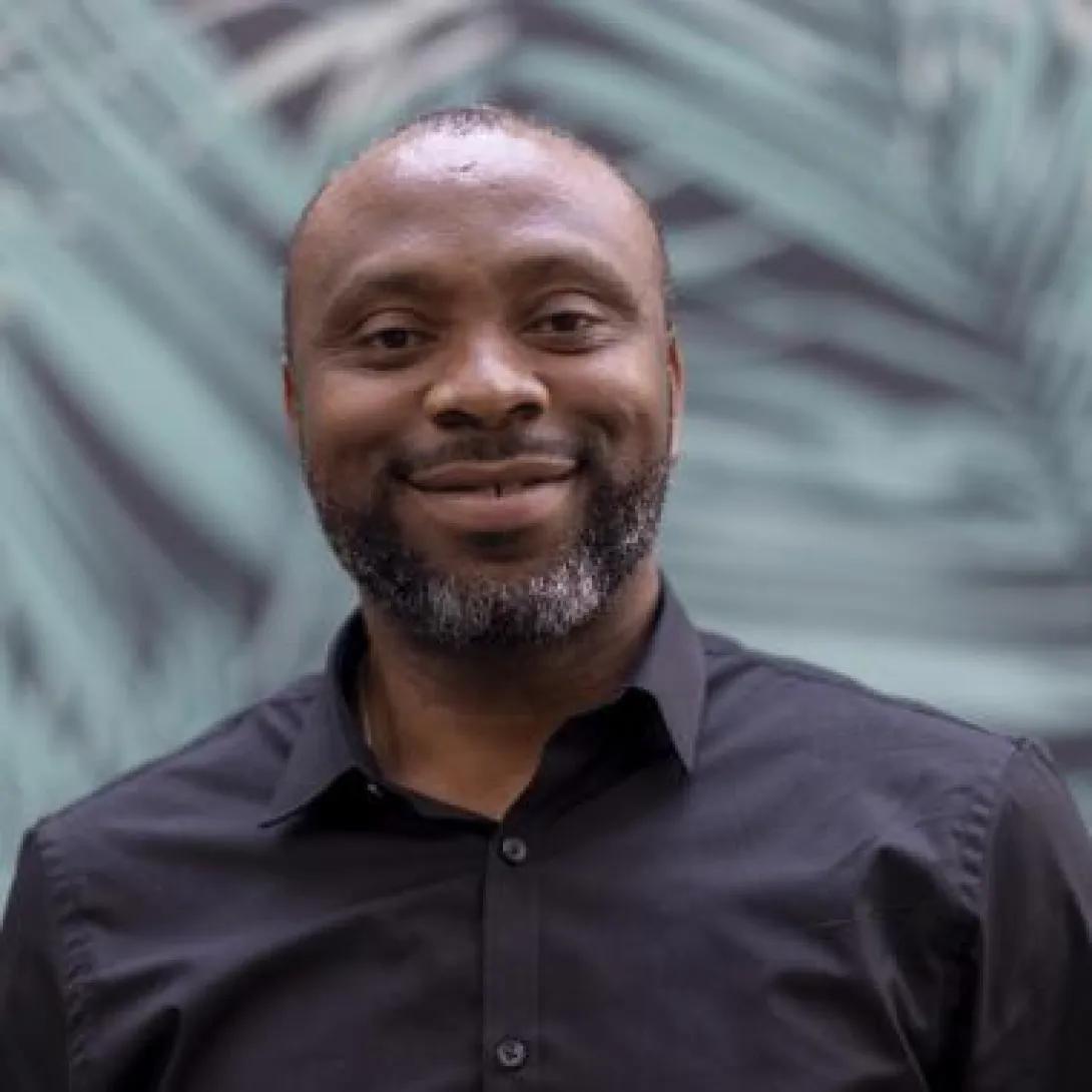 a Nigerian man wearing a black shirt