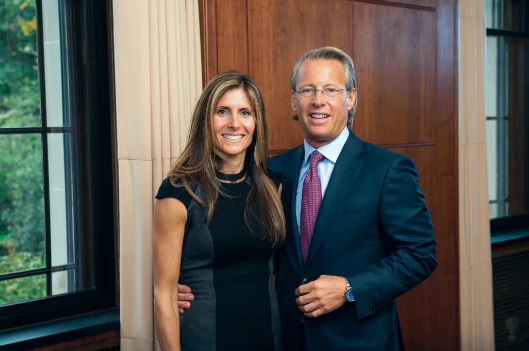 Portrait of Catherine and Nathan Forbes standing inside near a window