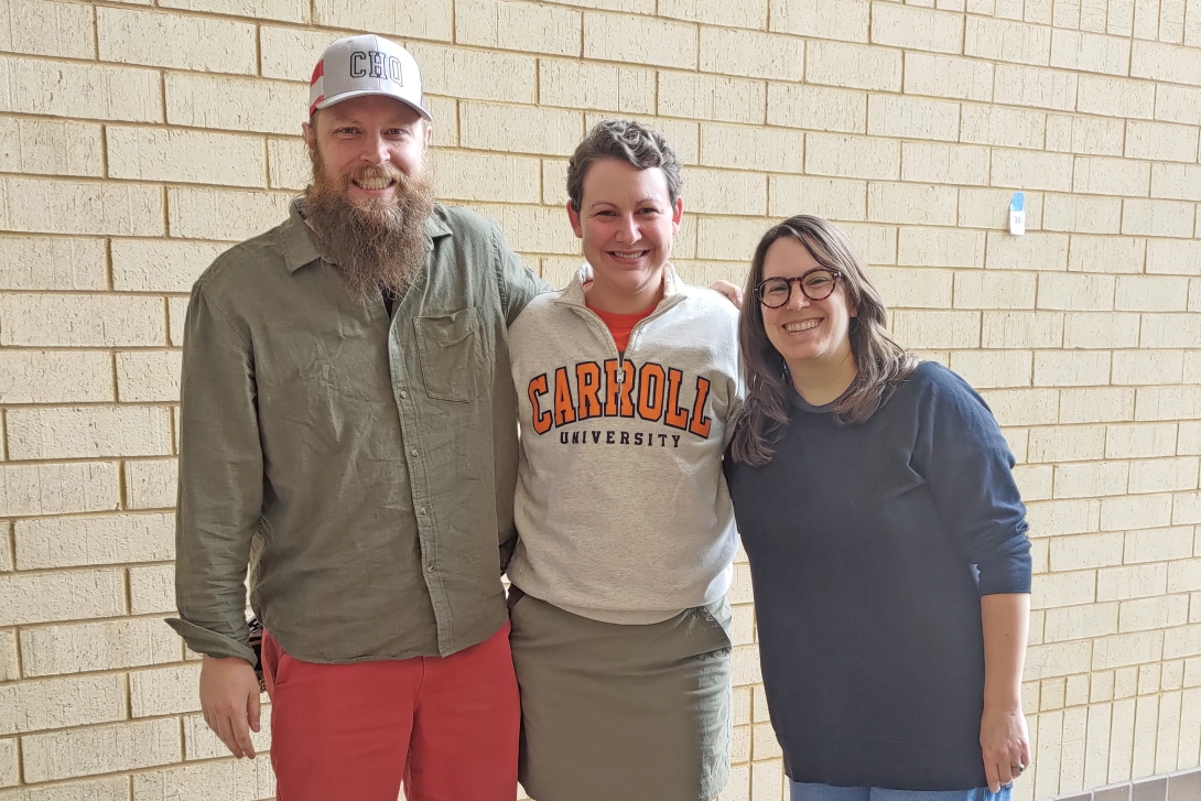 Three smiling people