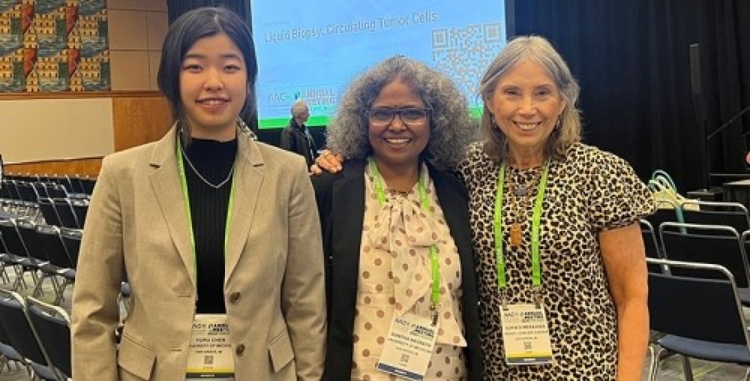 Yuru Chen, Ph.D. (standing to the left in the image with Sunitha Nagrath, Ph.D. and Sofia Merajver, M.D., Ph.D.)