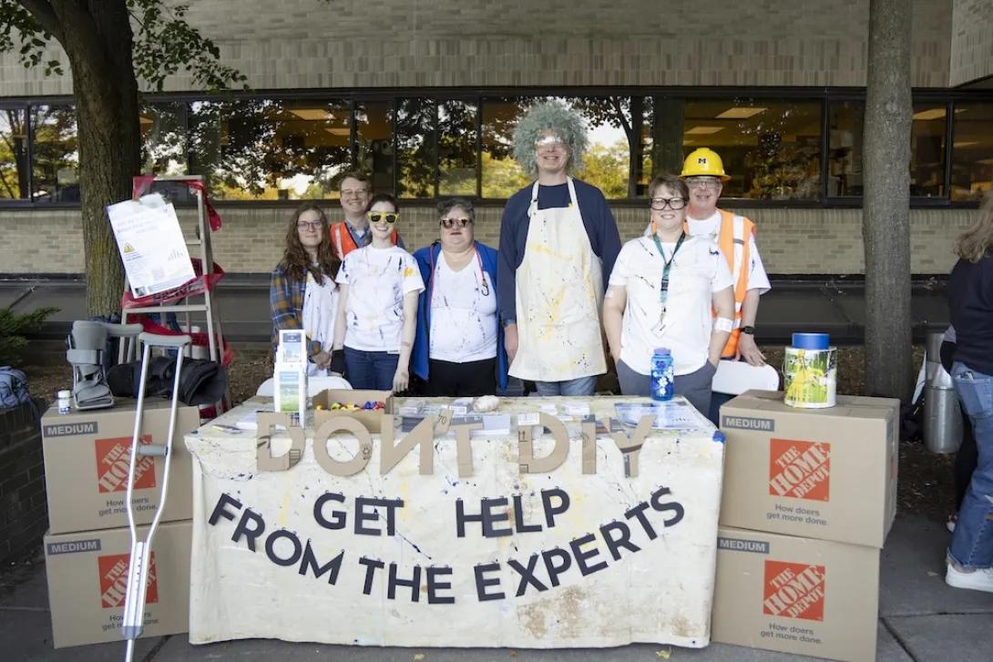 Photo of the facilities booth with staff