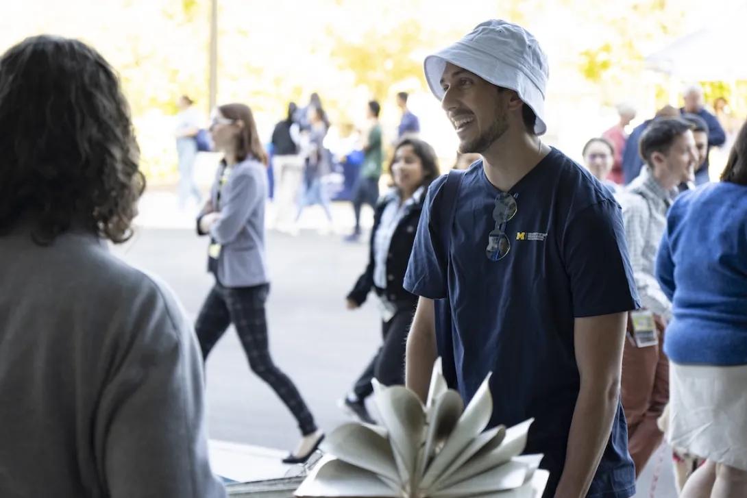 Photo of a staff member at a Researchpalooza booth
