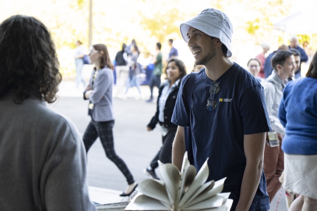 Photo of a staff member at a Researchpalooza booth
