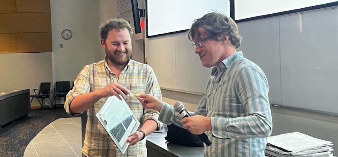 student receiving award in a lecture hall