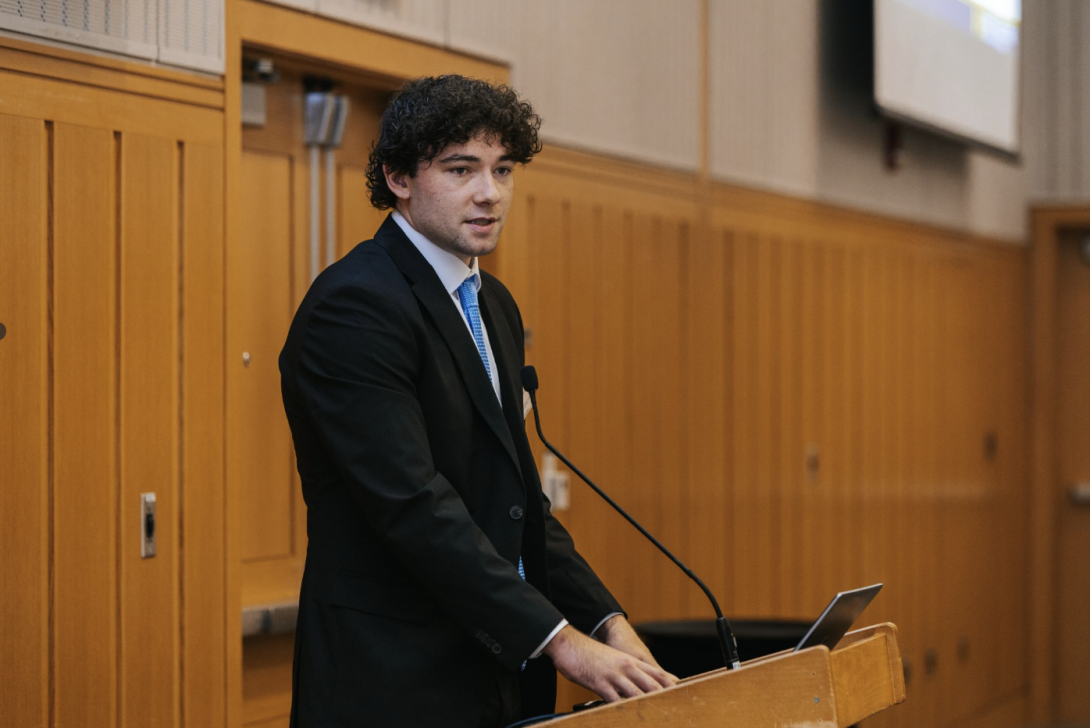 man presenting at a symposium