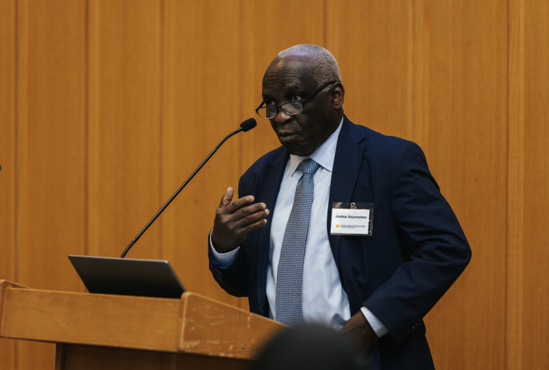 man presenting at a symposium