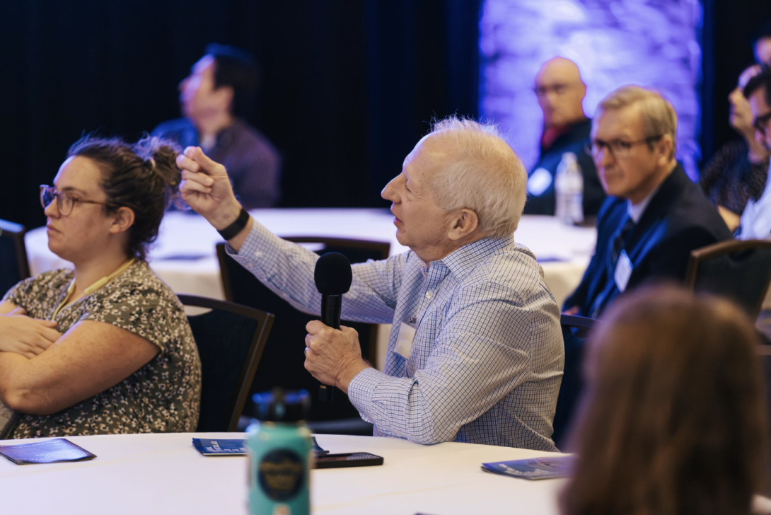 people asking questions at an event