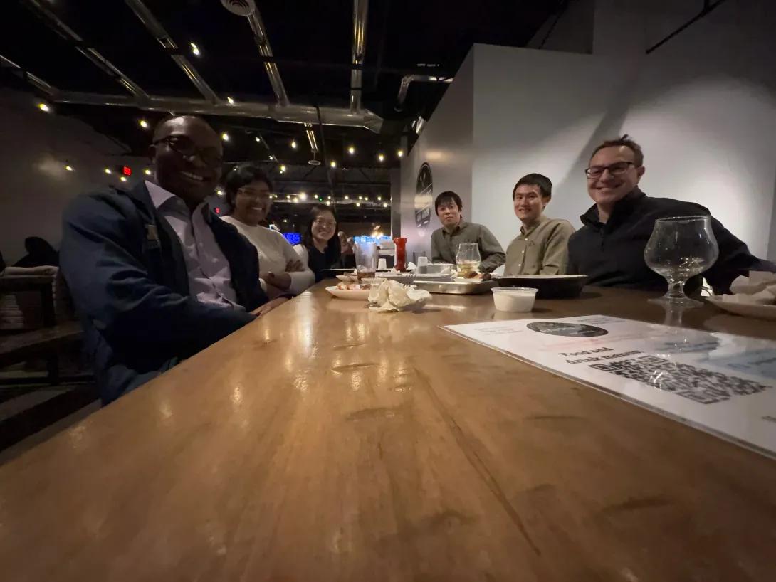 group posing for a photo at a restaurant