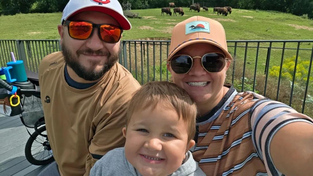 Atypical Teratoid Rhabdoid Tumor patient, Elliott with his mother and father at the Zoo.