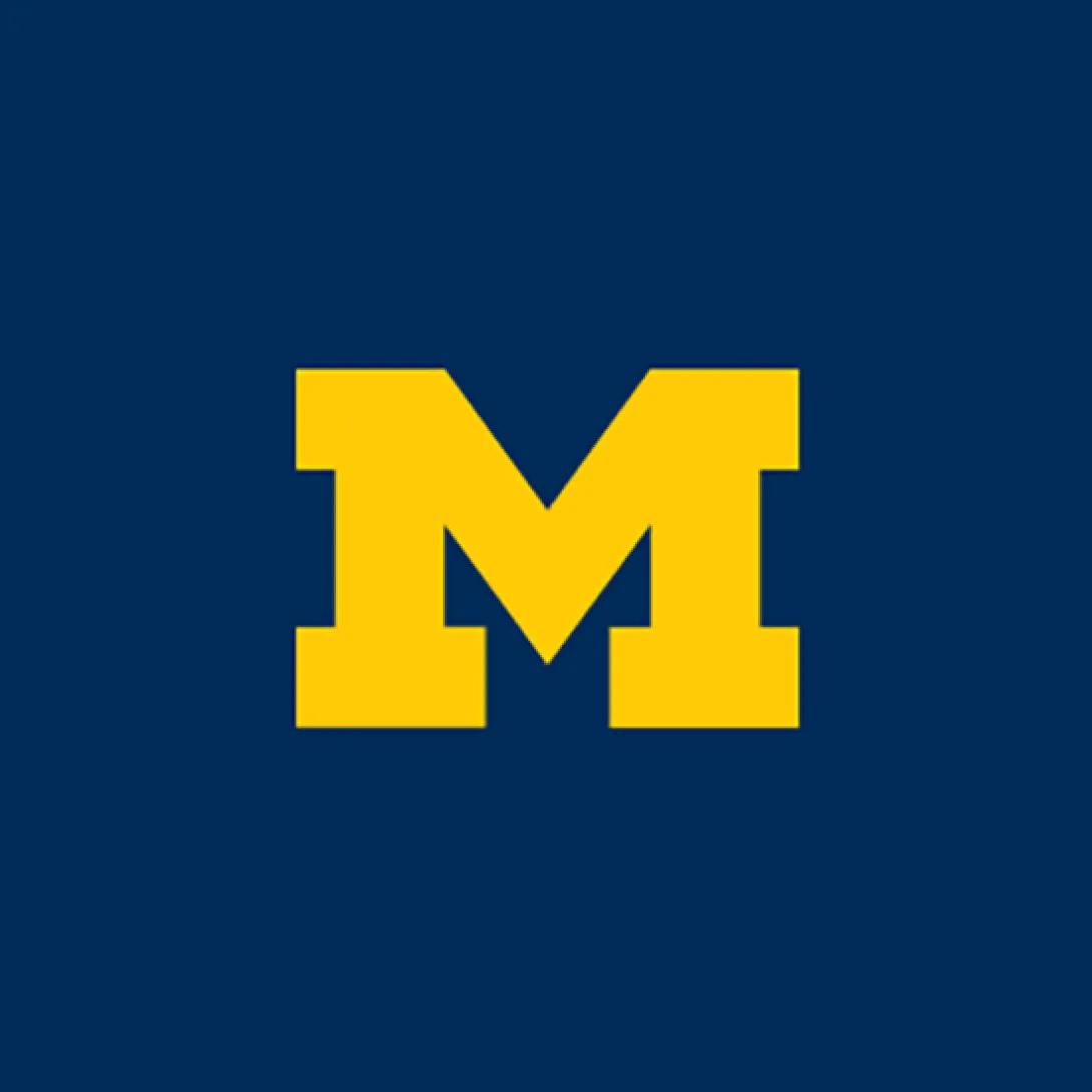 Yellow block M on dark blue background
