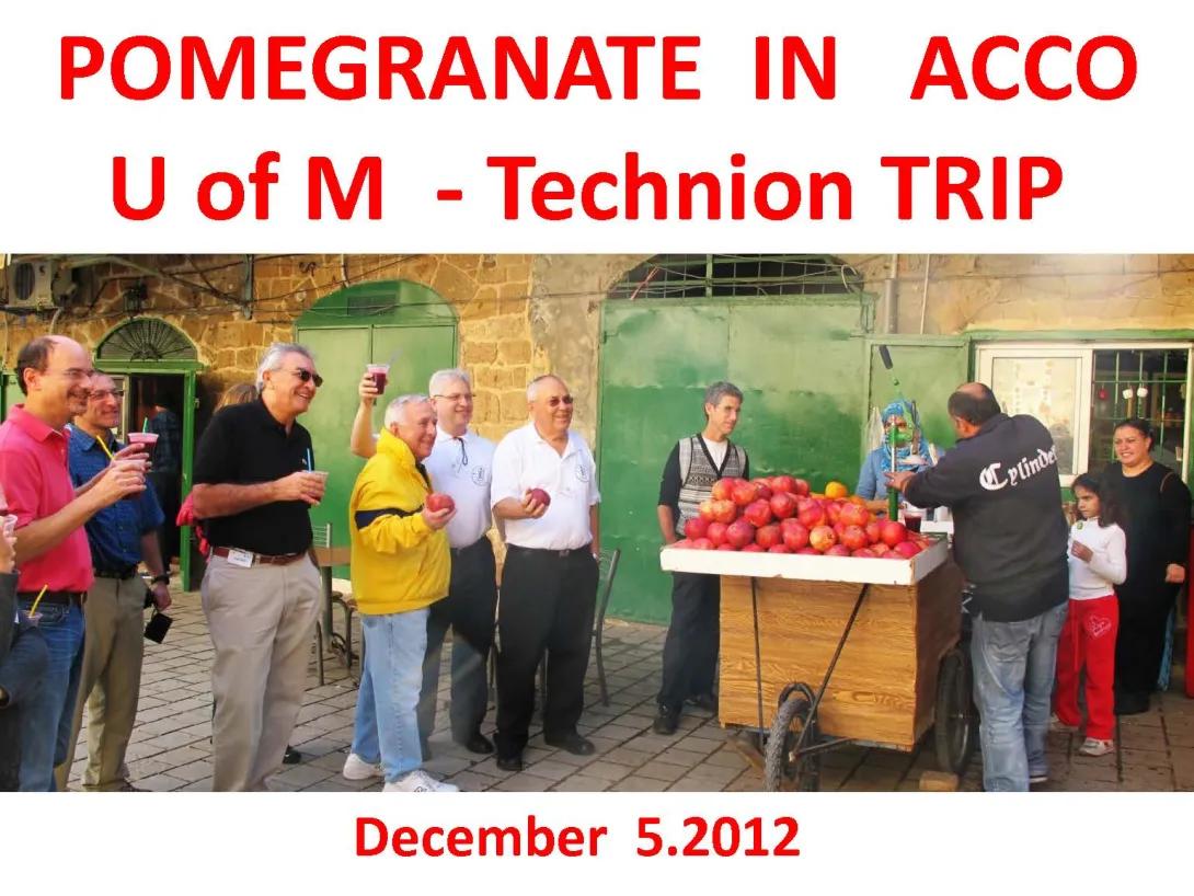 Candid image of group holding fruit outside