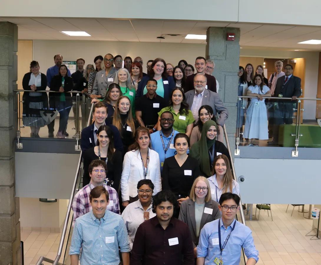a group photo on a staircase