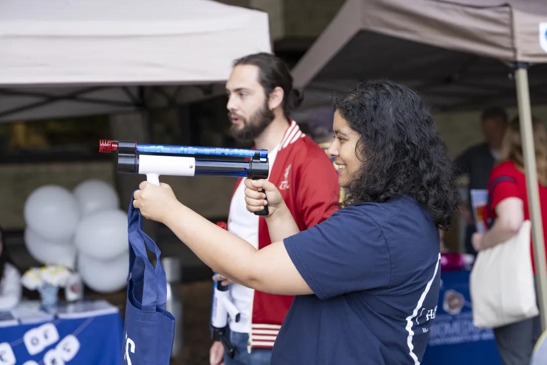 person playing a game at a tabling event outdoors