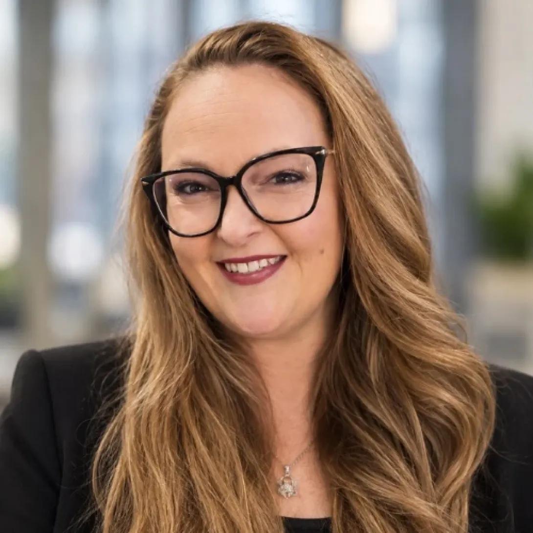Woman in glasses smiling